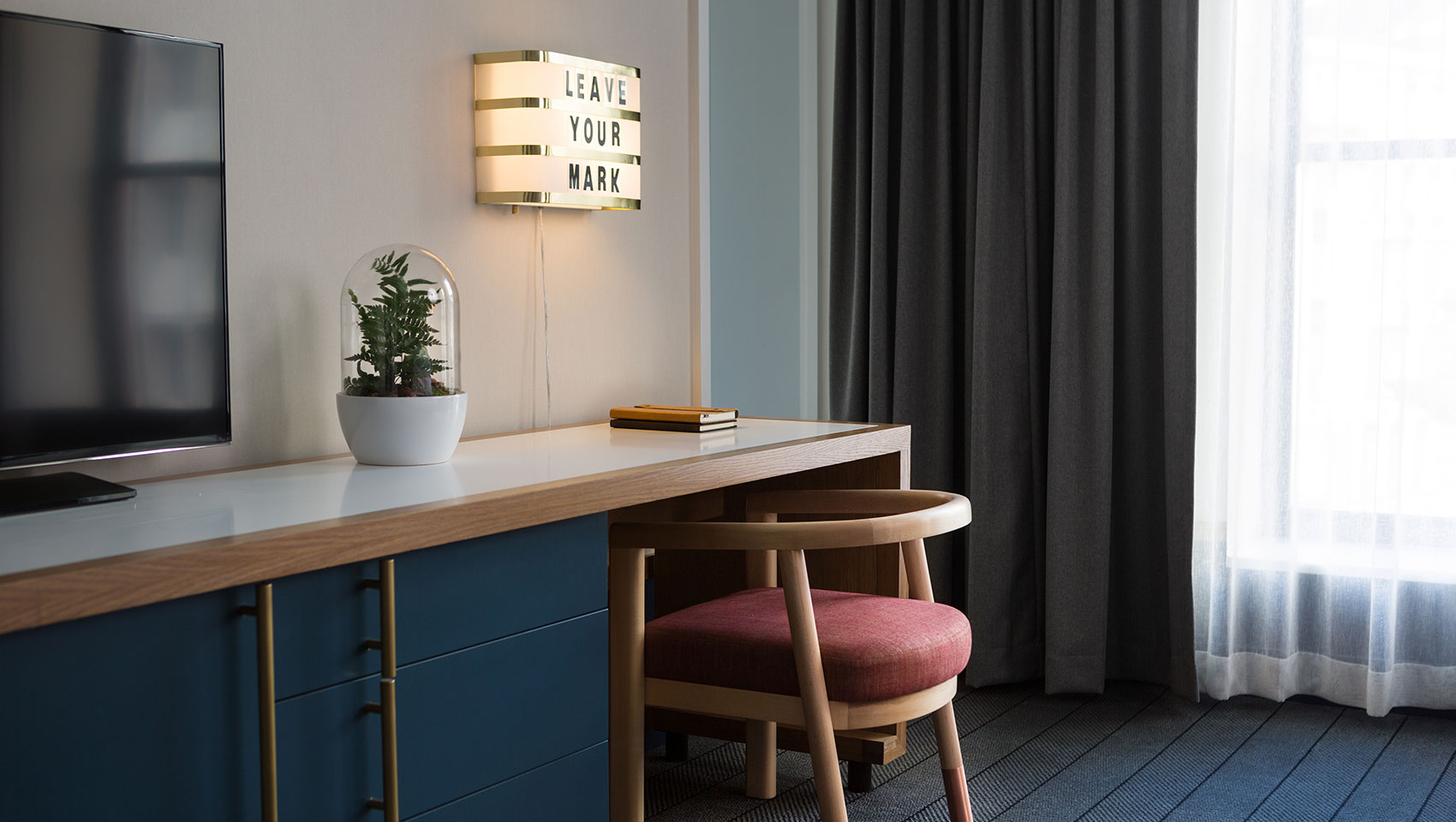Desk area of guestroom at Kimpton Schofield Hotel