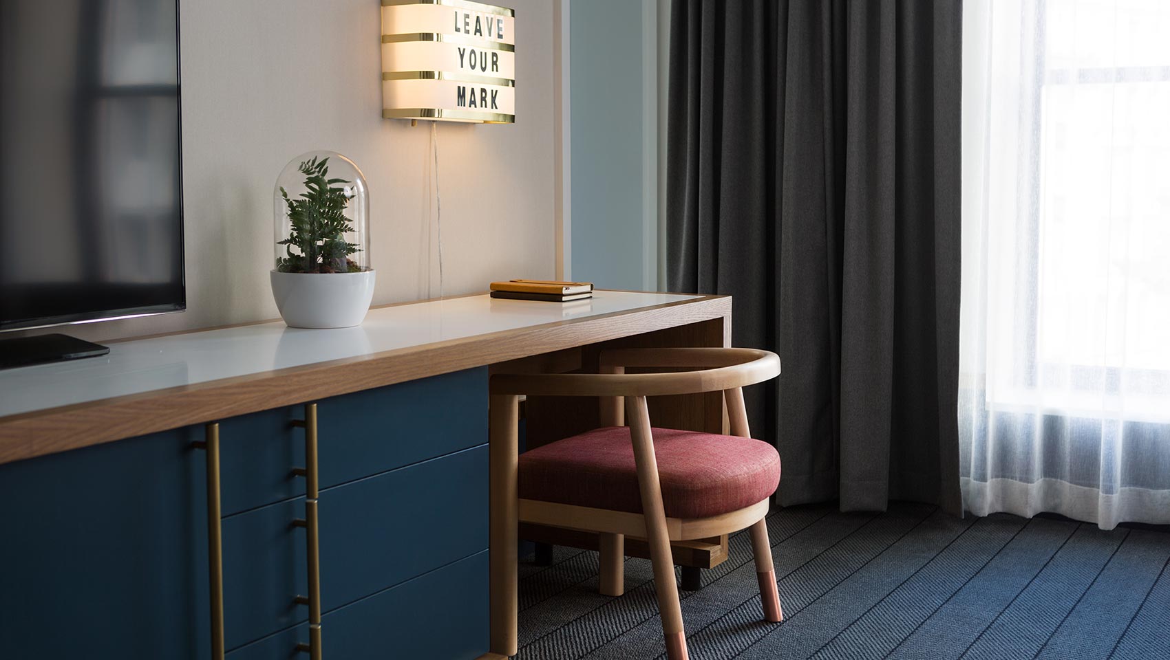 Desk area of guestroom at Kimpton Schofield Hotel